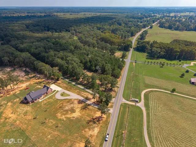 a view of a swimming pool with a yard