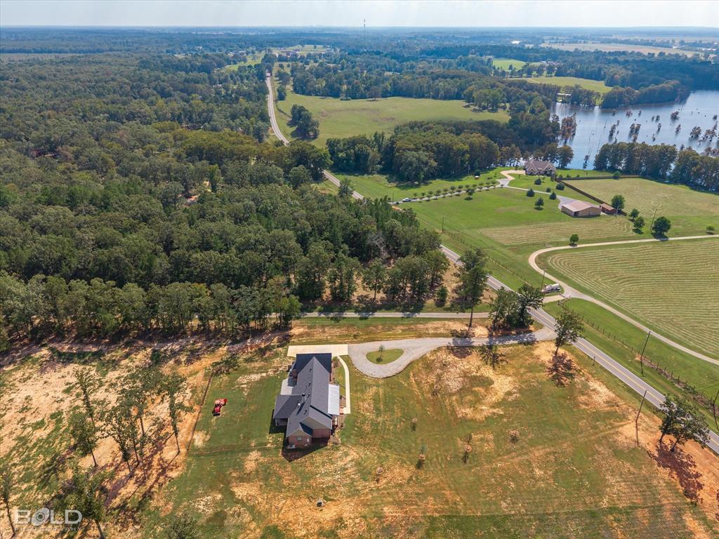 1228 Old Plain Dealing Road Benton, LA 71006 - Photo 10 of 11 a view of a swimming pool with a yard