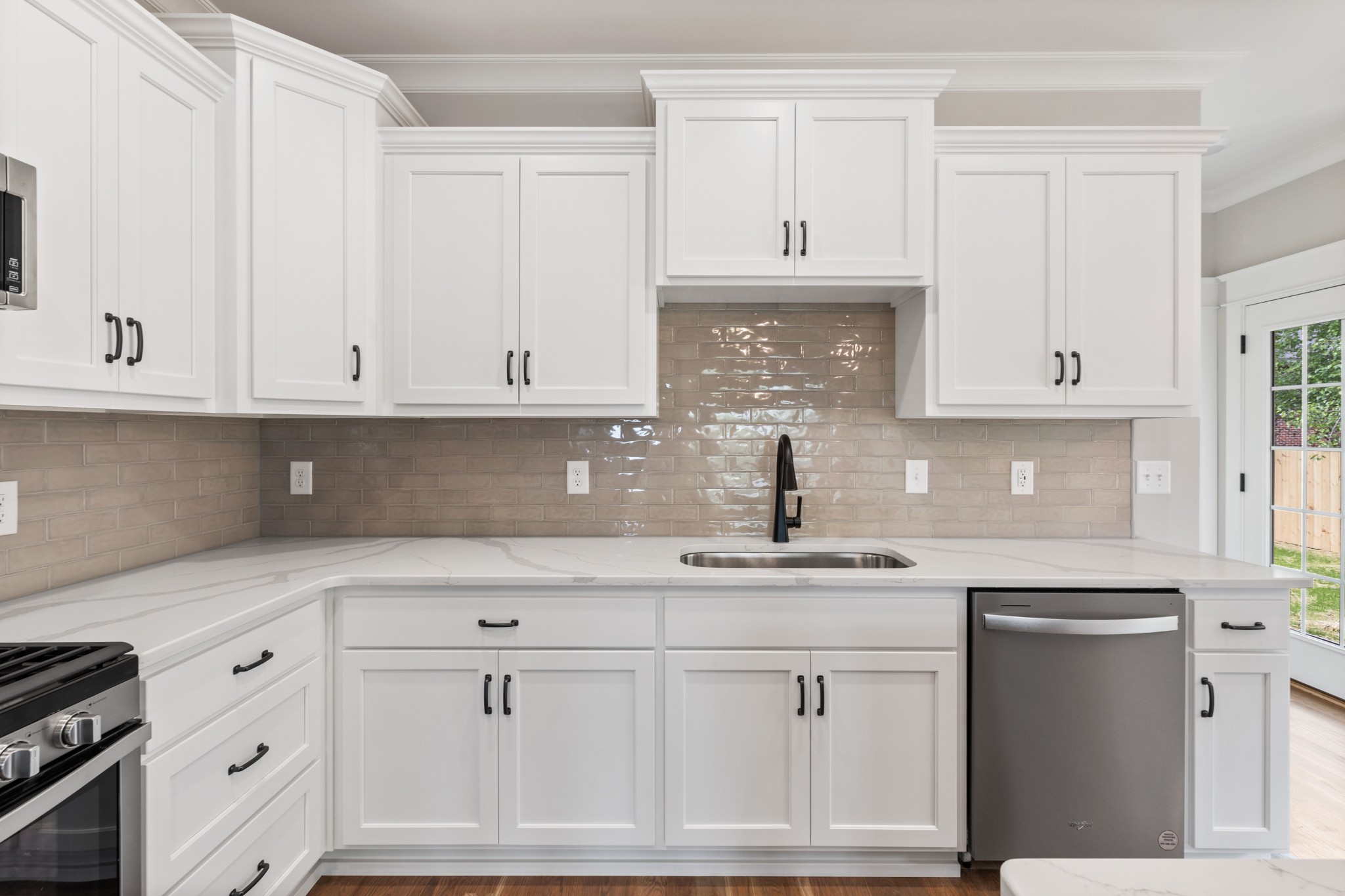 102 Mccreary Dickson, TN 37055 - Photo 12 of 31 a kitchen with white cabinets and a stove