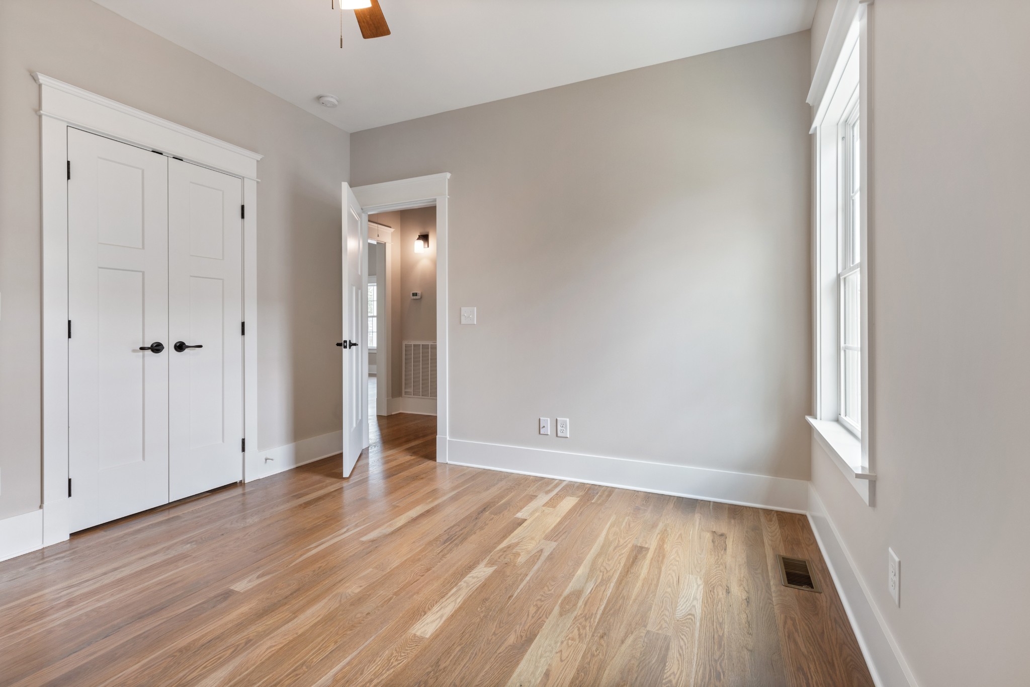102 Mccreary Dickson, TN 37055 - Photo 23 of 31 an empty room with wooden floor and windows