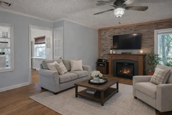 a living room with furniture and a fireplace