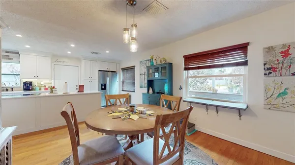 a view of a dining room with furniture window and outside view