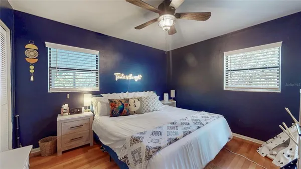 a bedroom with a large bed and a window