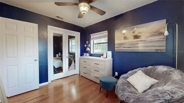 a bedroom with a bed and a dresser