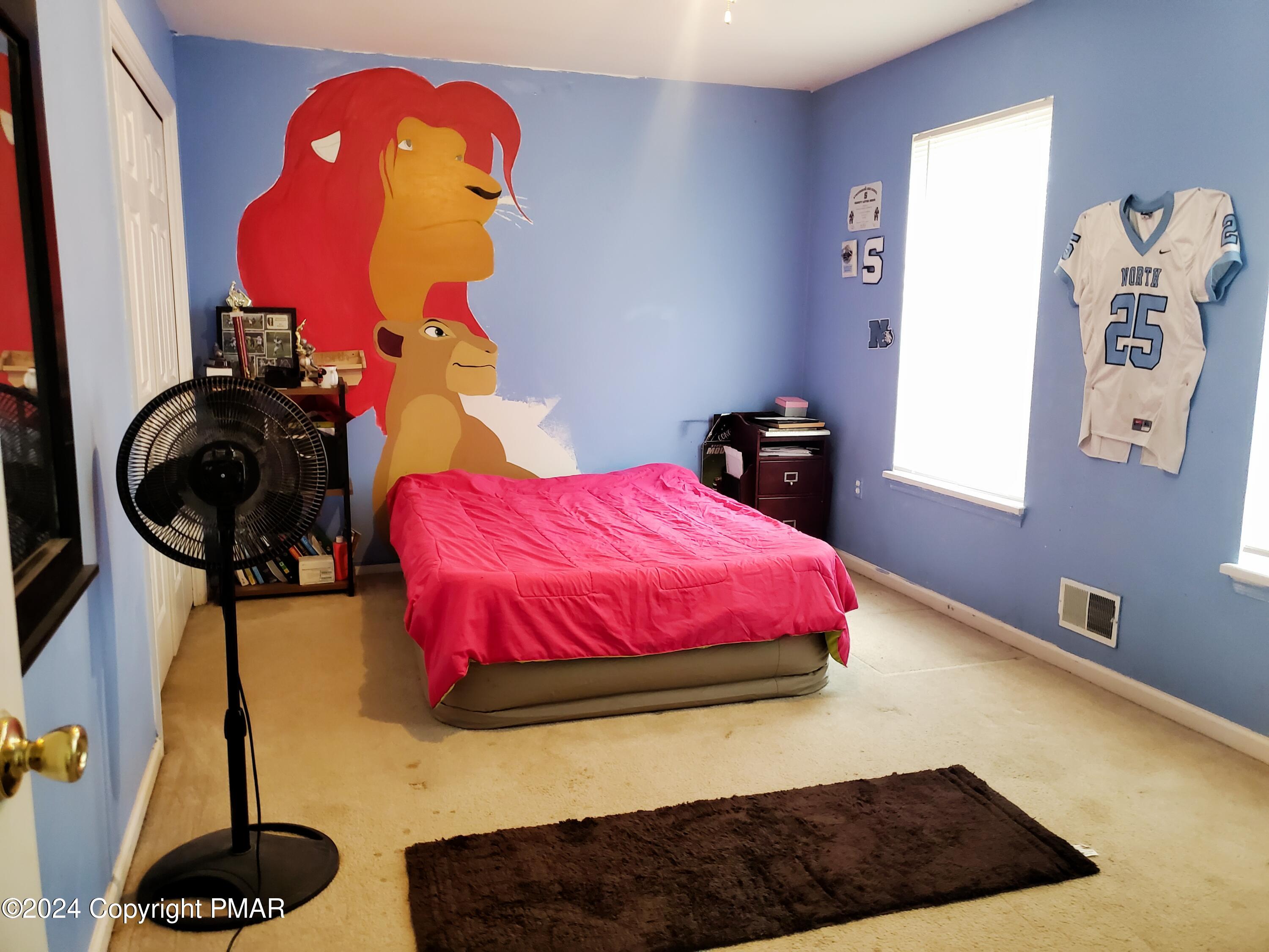 1102 Steele Circle Bushkill, PA 18324 - Photo 12 of 23 a bedroom with a bed and dresser