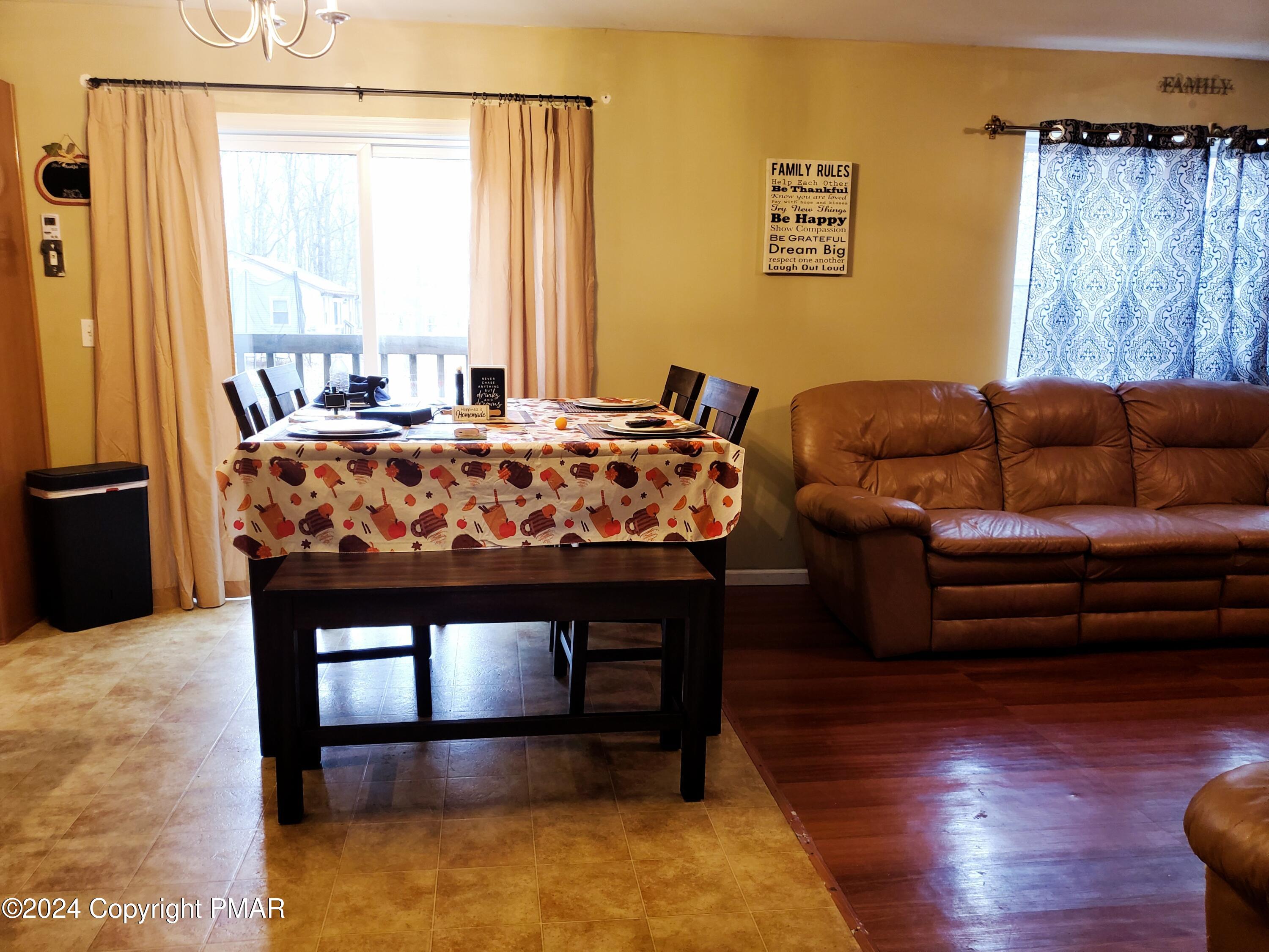 1102 Steele Circle Bushkill, PA 18324 - Photo 14 of 23 a living room with a couch and a table