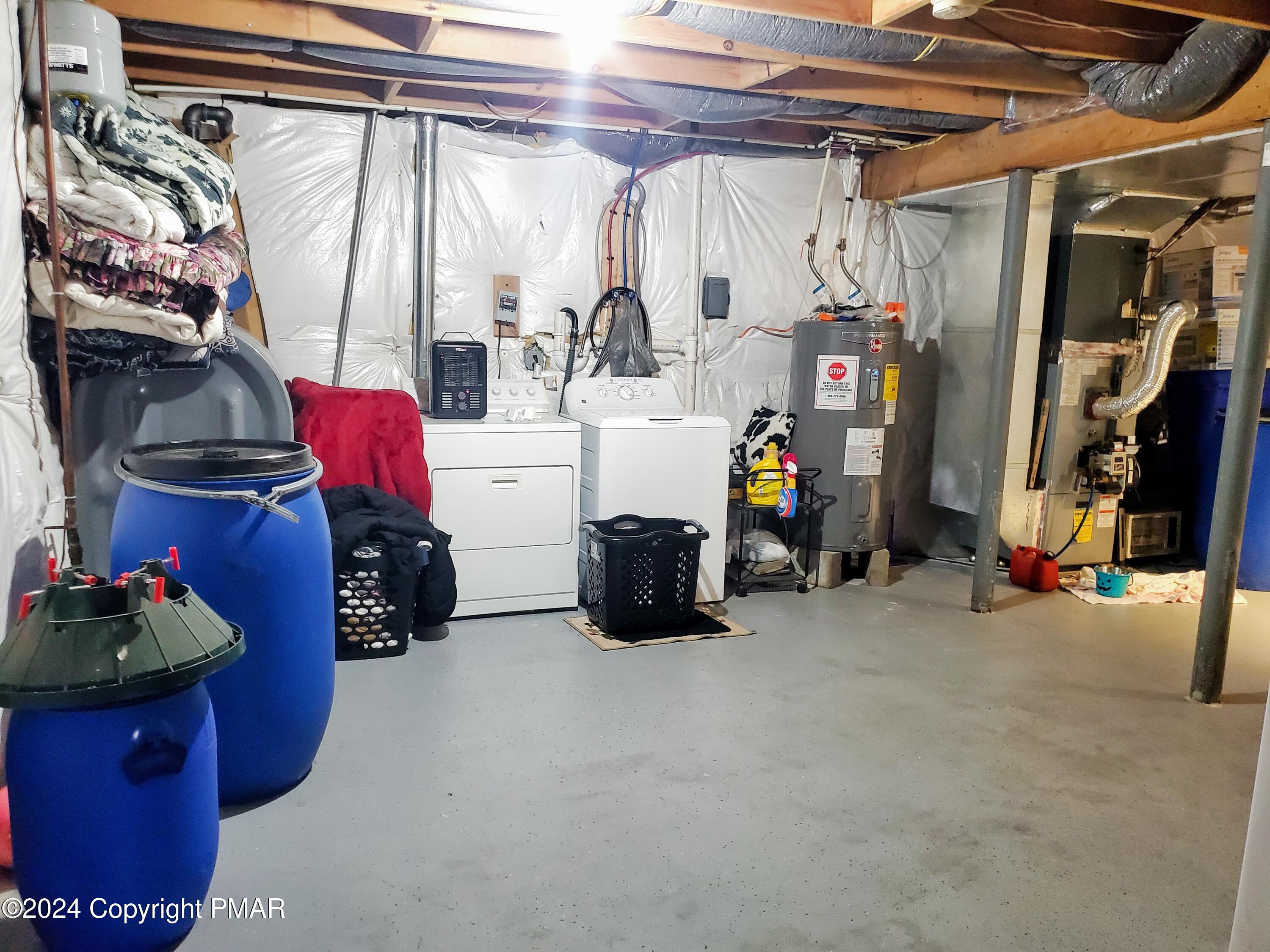 1102 Steele Circle Bushkill, PA 18324 - Photo 20 of 23 a view of walk in closet with clothes and shoes