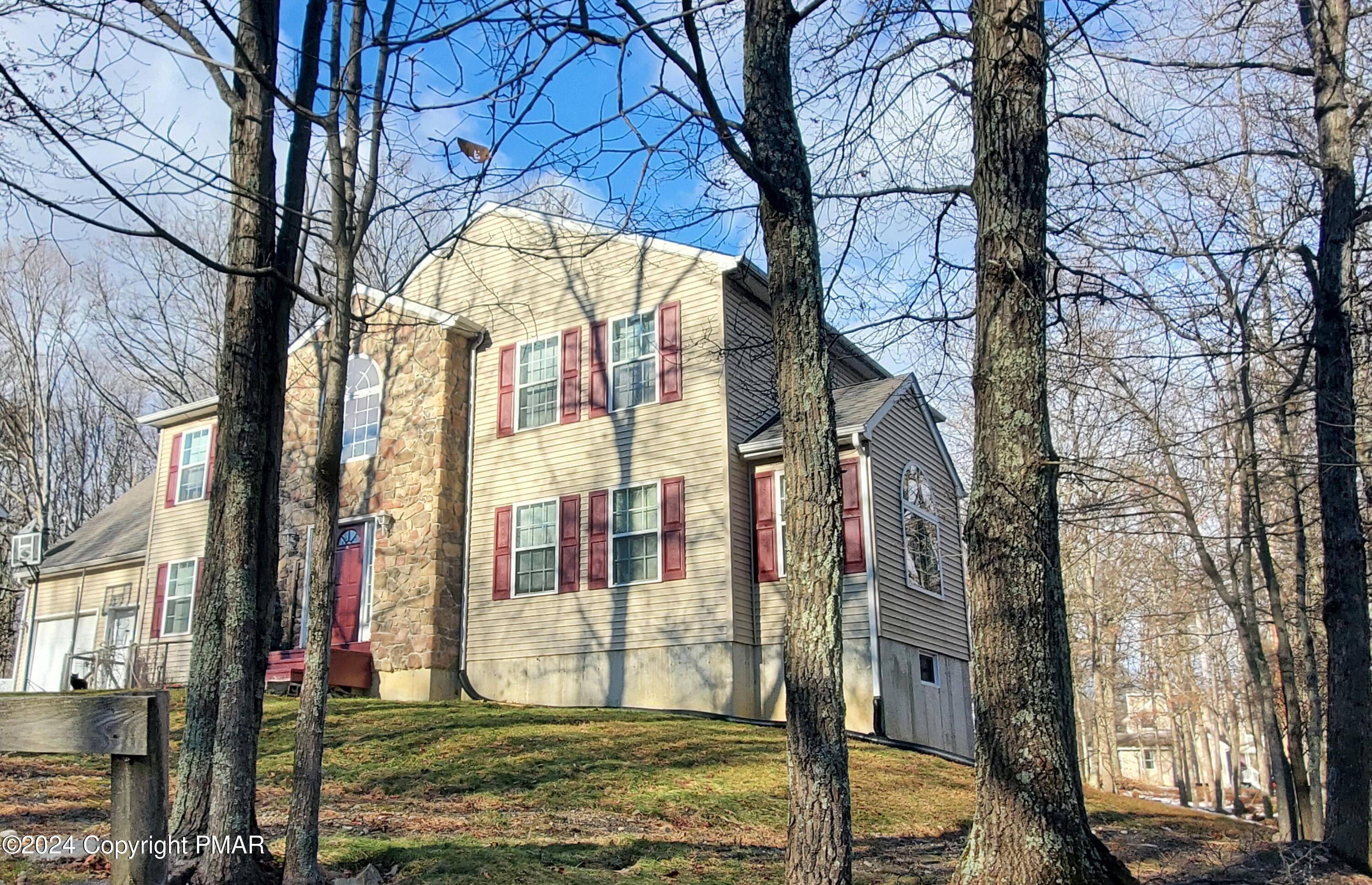 1102 Steele Circle Bushkill, PA 18324 - Photo 23 of 23 a building with trees in front of it