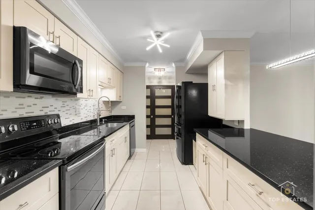 a kitchen with a sink stove and microwave
