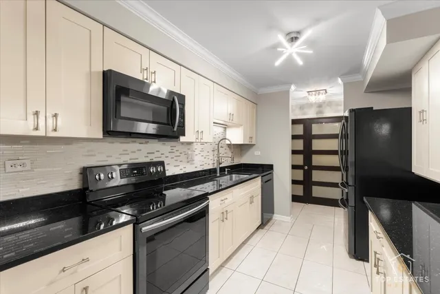 a kitchen with appliances cabinets and a sink