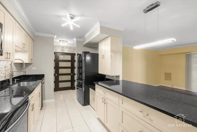 a kitchen with stainless steel appliances granite countertop a sink and cabinets