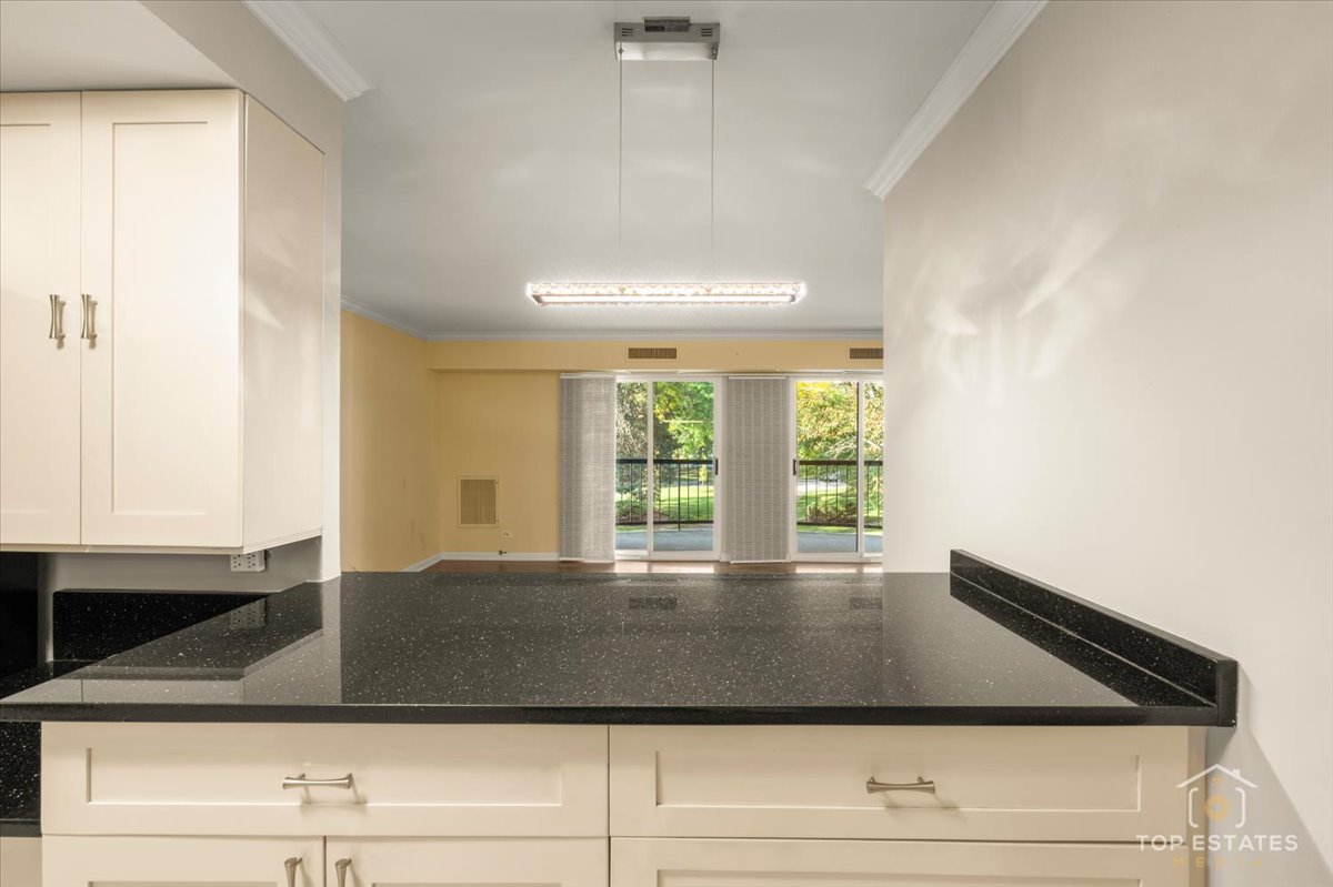 1615 East Central Road, Unit 218C Arlington Heights, IL 60005 - Photo 15 of 33 a view of wooden floor and living room