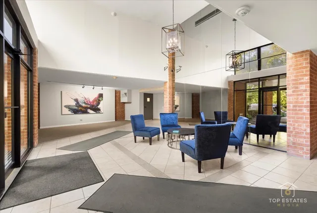 a living room with furniture a window and a table