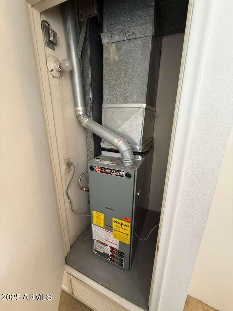 830 East 9th Street, Unit 1 Douglas, AZ 85607 - Photo 13 of 22 a view of walk in closet with clothes and shoes