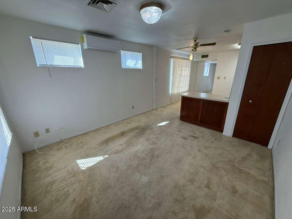 830 East 9th Street, Unit 1 Douglas, AZ 85607 - Photo 3 of 22 an empty room with windows