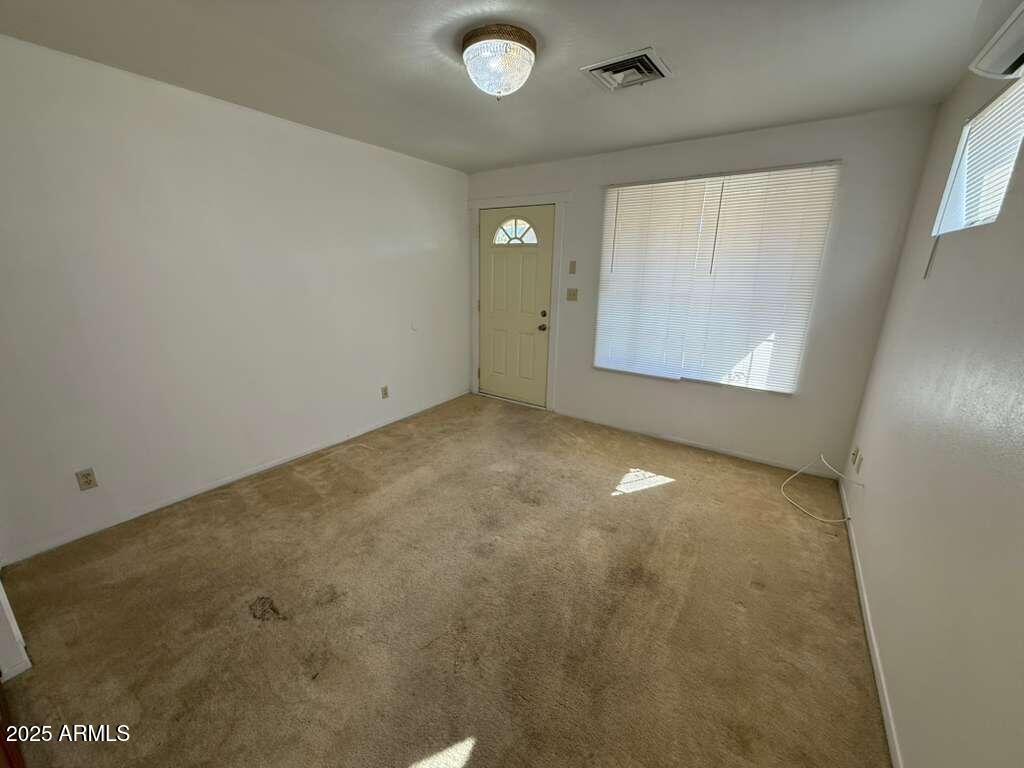 830 East 9th Street, Unit 1 Douglas, AZ 85607 - Photo 4 of 22 an empty room with windows