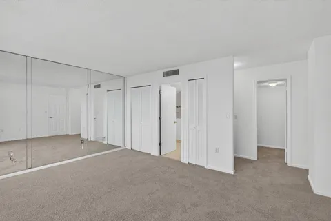 a bathroom with a shower sink and mirror