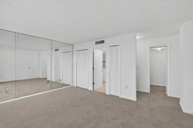 a bathroom with a shower sink and mirror