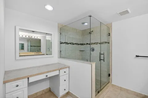 an empty room with sliding door and mountain view