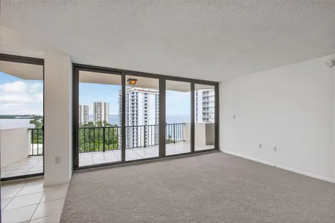 a view of an empty room and a window