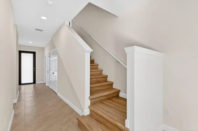 a view of a hallway with staircase