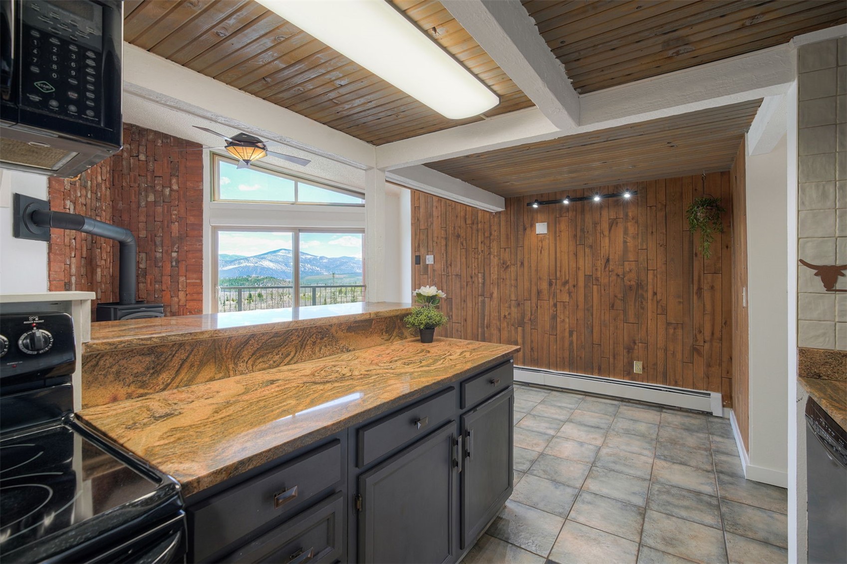 7031 Ryan Gulch Road, Unit 301 Silverthorne, CO 80498 - Photo 12 of 37 a room with pool table and windows