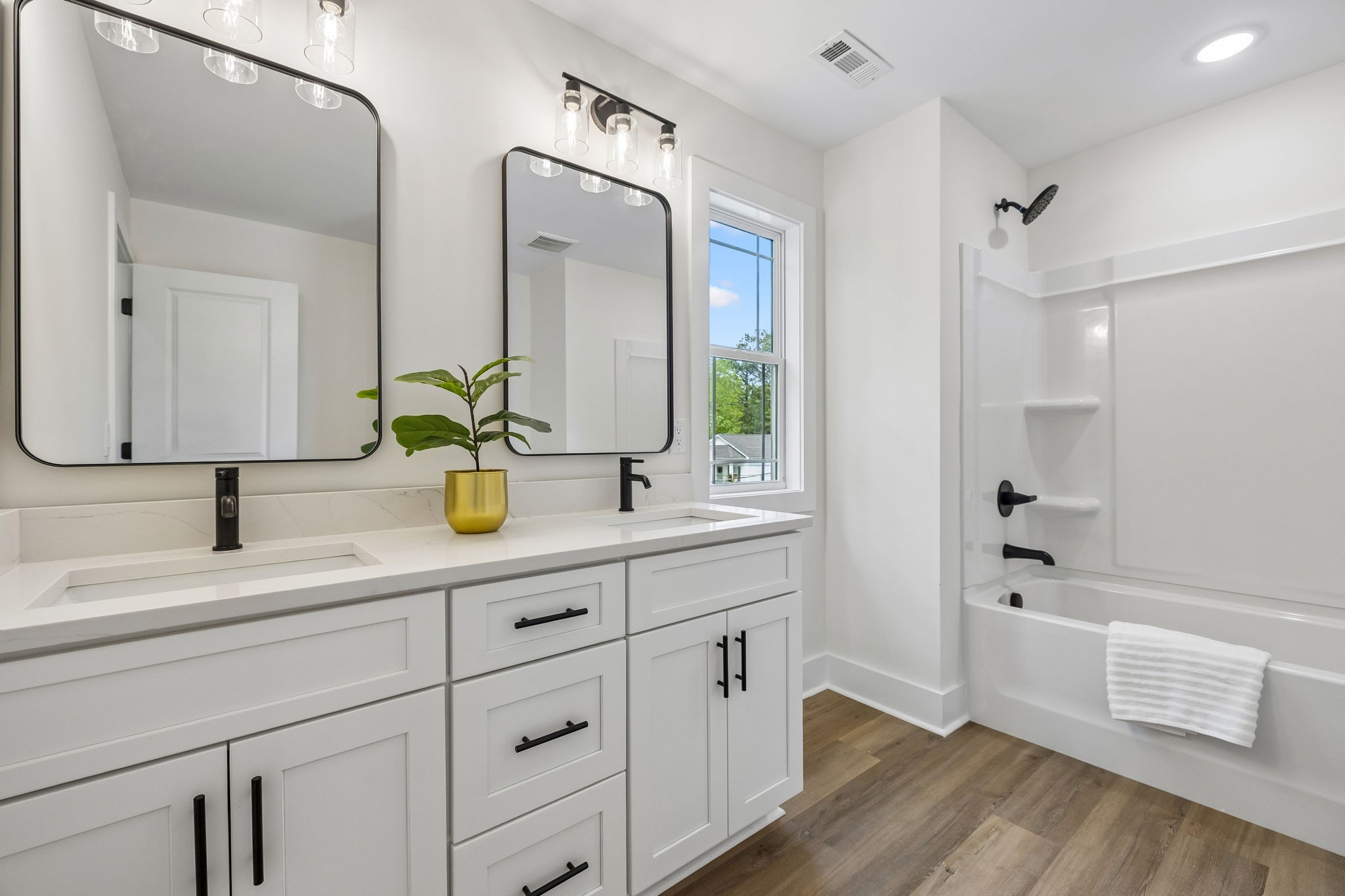 419 North Mabel Street Springfield, TN 37172 - Photo 23 of 34 a bathroom with a sink double vanity granite tub shower and a mirror