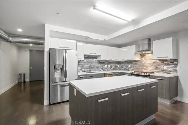 a kitchen with a sink a stove and refrigerator