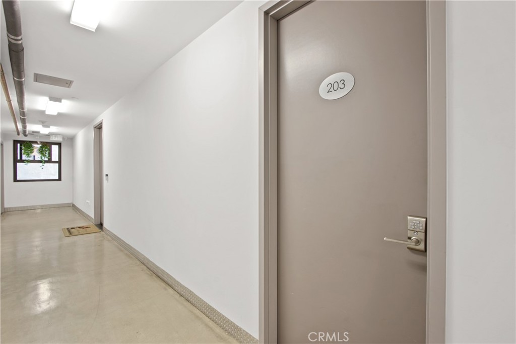 433 Pine Avenue, Unit 203 Long Beach, CA 90802 - Photo 11 of 19 a view of a hallway with front door