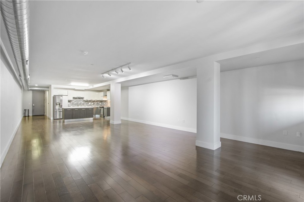 433 Pine Avenue, Unit 203 Long Beach, CA 90802 - Photo 4 of 19 a view of a room with wooden floor
