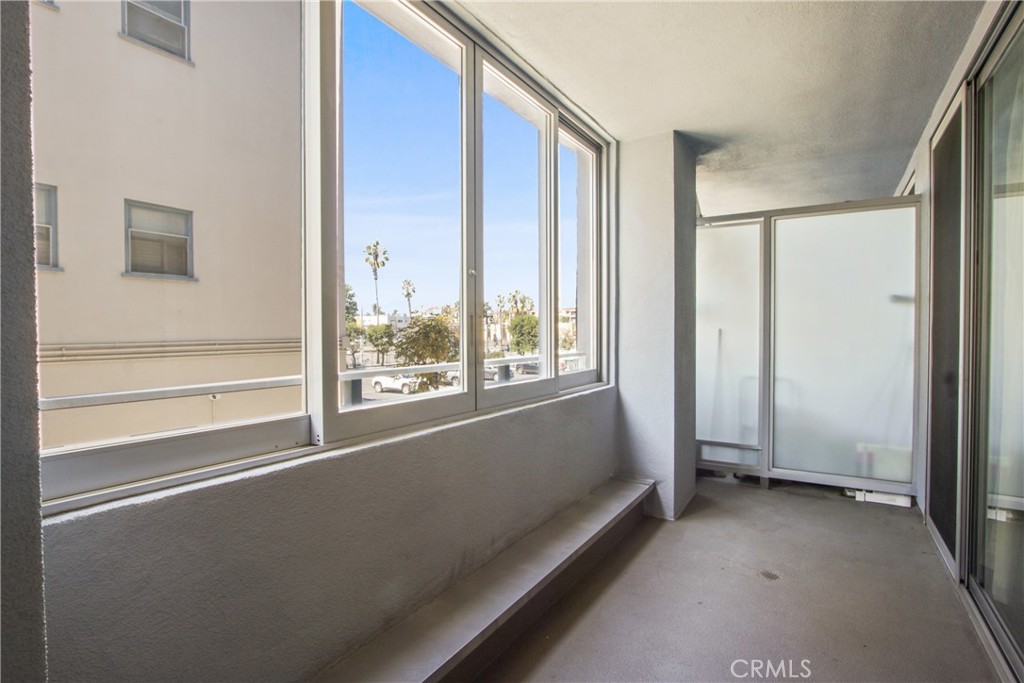 433 Pine Avenue, Unit 203 Long Beach, CA 90802 - Photo 6 of 19 a view of room with window and floor to ceiling window
