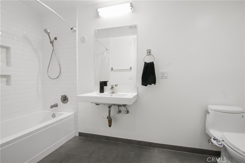 433 Pine Avenue, Unit 203 Long Beach, CA 90802 - Photo 9 of 19 a bathroom with a sink a toilet and bathtub