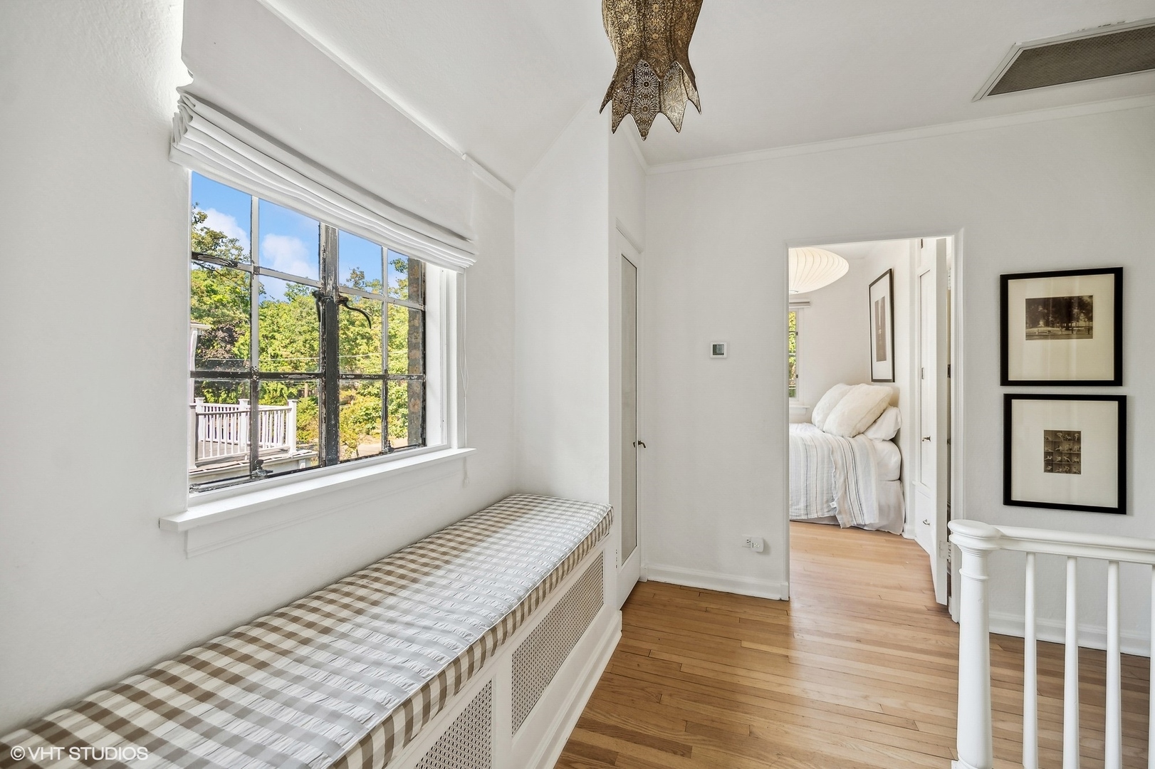180 Randolph Street Glencoe, IL 60022 - Photo 19 of 36 a view of a bedroom with wooden floor and windows