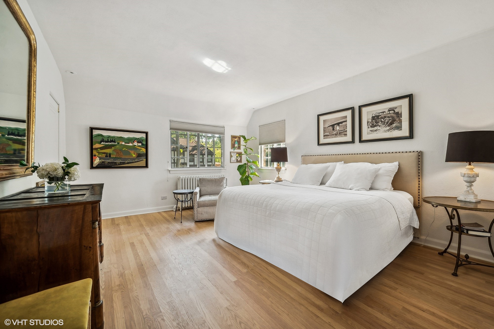 180 Randolph Street Glencoe, IL 60022 - Photo 21 of 36 a large bedroom with a bed and wooden floor