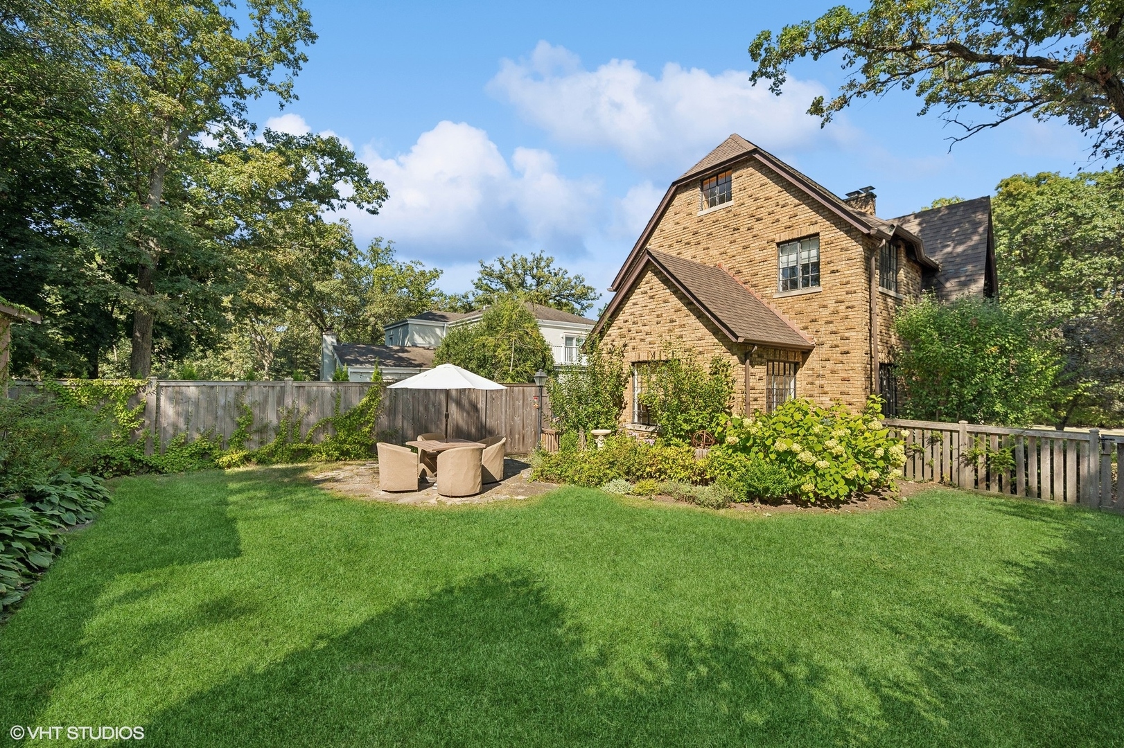 180 Randolph Street Glencoe, IL 60022 - Photo 27 of 36 a front view of a house with garden