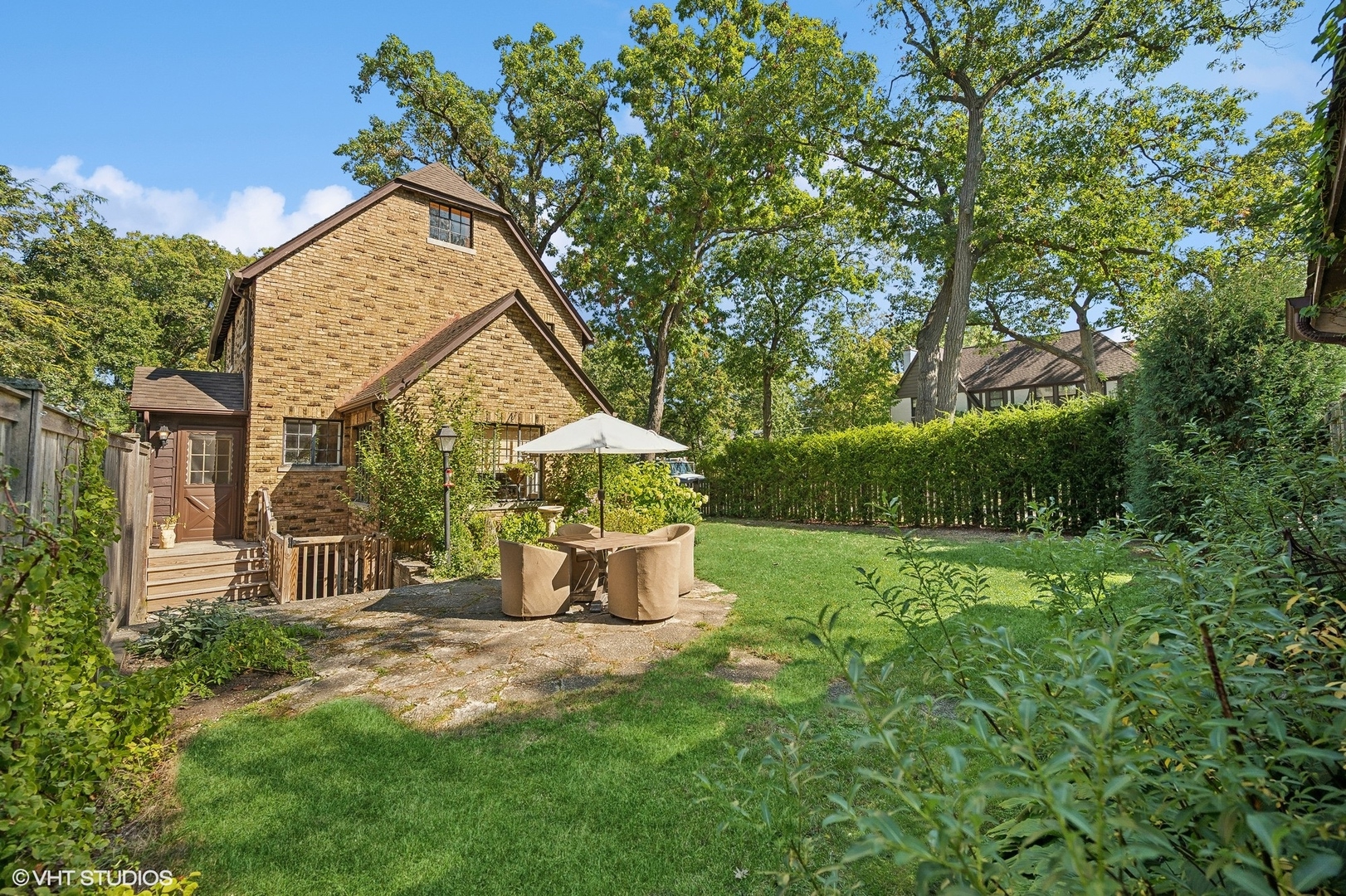 180 Randolph Street Glencoe, IL 60022 - Photo 28 of 36 a view of a house with a yard and basketball ground