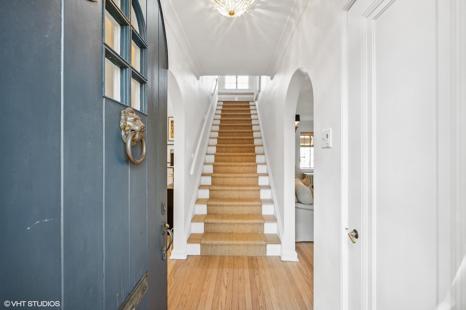 180 Randolph Street Glencoe, IL 60022 - Photo 4 of 36 a view of stairs and hall with wooden floor