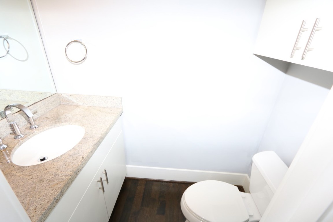 2103 Hadley Street Houston, TX 77003 - Photo 12 of 19 a bathroom with a granite countertop sink and a mirror