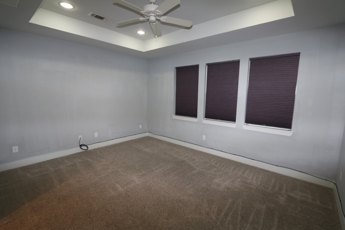 2103 Hadley Street Houston, TX 77003 - Photo 13 of 19 an empty room with a ceiling fan and window