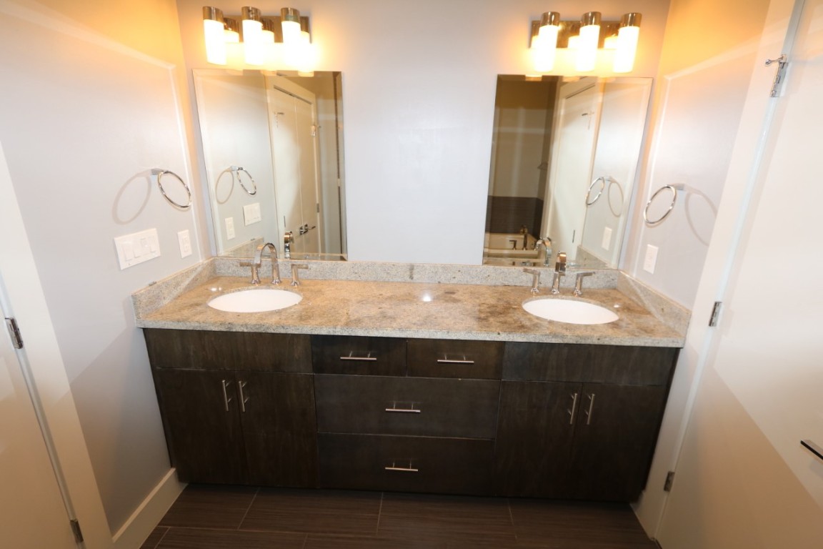 2103 Hadley Street Houston, TX 77003 - Photo 14 of 19 a bathroom with a sink vanity and a mirror