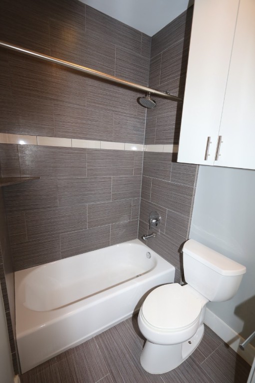 2103 Hadley Street Houston, TX 77003 - Photo 4 of 19 a white toilet sitting next to a bath tub