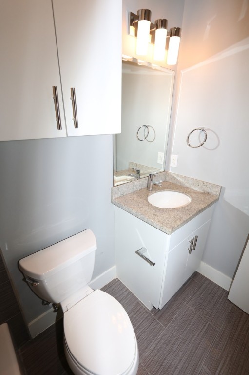 2103 Hadley Street Houston, TX 77003 - Photo 5 of 19 a bathroom with a toilet sink and mirror