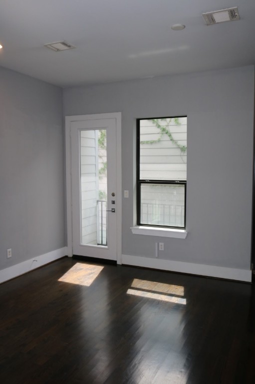 2103 Hadley Street Houston, TX 77003 - Photo 7 of 19 a view of an empty room with wooden floor and a window
