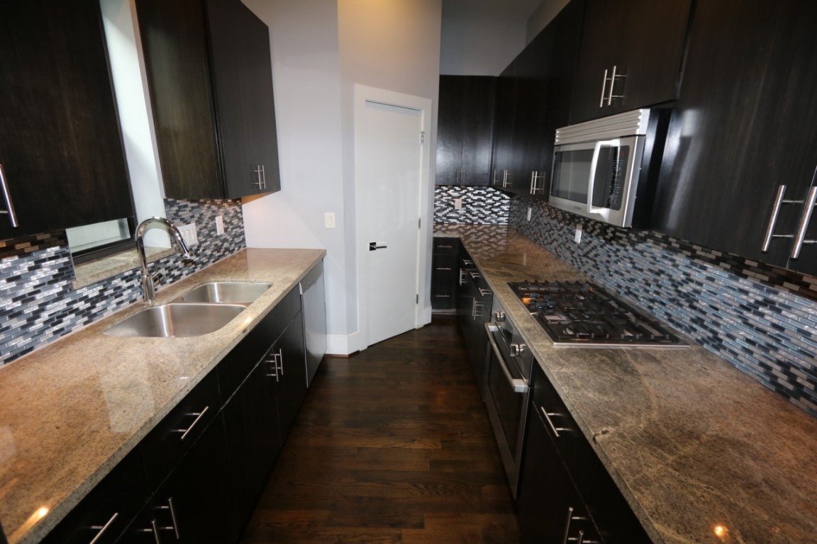 2103 Hadley Street Houston, TX 77003 - Photo 8 of 19 a kitchen with a sink stove and refrigerator