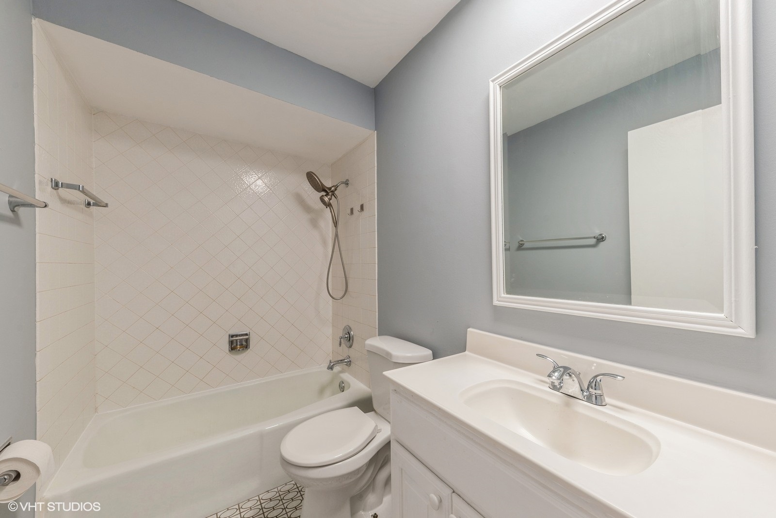 806 North River Road, Unit 3A Mount Prospect, IL 60056 - Photo 8 of 11 a bathroom with a sink toilet tub vanity and shower