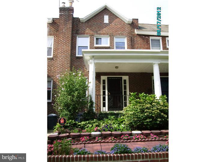 7028 Cresheim Road Philadelphia, PA 19119 - Photo 1 of 23 a front view of a house with a yard
