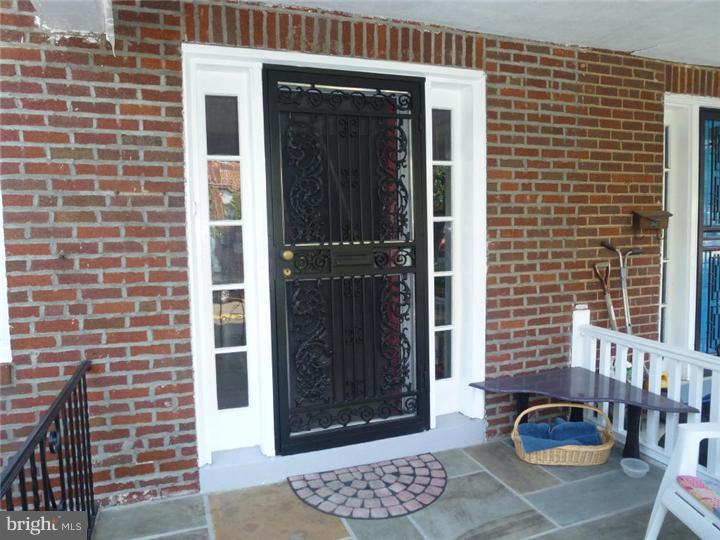 7028 Cresheim Road Philadelphia, PA 19119 - Photo 2 of 23 a front view of a house with a glass door