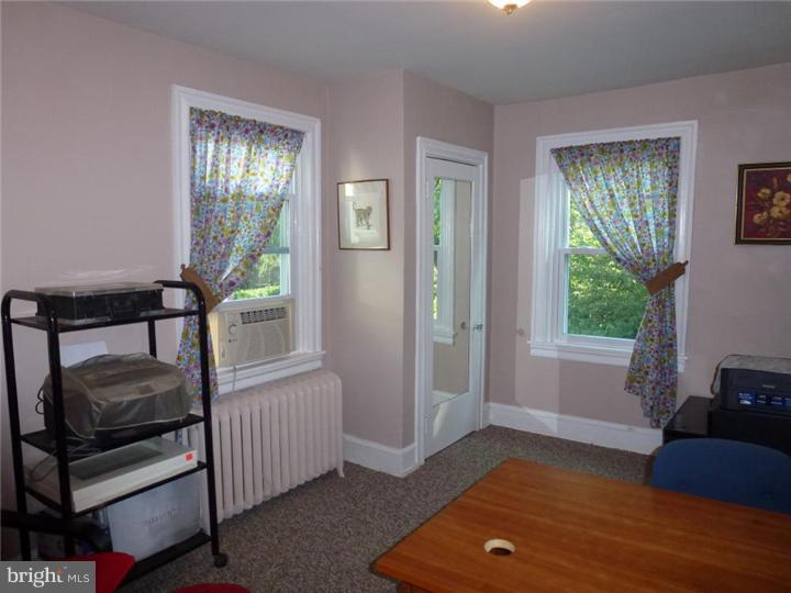 7028 Cresheim Road Philadelphia, PA 19119 - Photo 14 of 23 a living room with furniture and a window