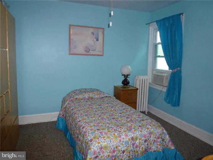 7028 Cresheim Road Philadelphia, PA 19119 - Photo 15 of 23 a bedroom with a bed and a window
