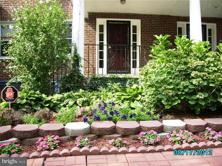 7028 Cresheim Road Philadelphia, PA 19119 - Photo 23 of 23 a bunch of flowers are in a garden